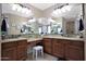 Elegant bathroom with double vanity, granite countertop, and ample storage at 19428 W Colter St, Litchfield Park, AZ 85340