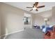 Spacious bedroom with access to another room and a crib at 19428 W Colter St, Litchfield Park, AZ 85340