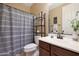 Well-appointed bathroom includes a vanity, toilet, and shower/tub combo at 19428 W Colter St, Litchfield Park, AZ 85340