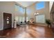 Spacious living room with hardwood floors, high ceilings, and large windows at 19428 W Colter St, Litchfield Park, AZ 85340