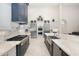 Gourmet kitchen with two-toned cabinetry, large island, and high-end appliances at 18610 W Porter Dr # 93, Goodyear, AZ 85338