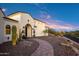 Luxury Spanish-style home showcasing a welcoming entryway and landscaping at 18610 W Porter Dr # 93, Goodyear, AZ 85338