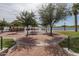 Lakeside gazebo with brick pathway and lush landscaping at 18610 W Porter Dr # 93, Goodyear, AZ 85338