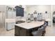 Gourmet kitchen with two-toned cabinetry, large island, and high-end appliances at 18610 W Porter Dr # 93, Goodyear, AZ 85338