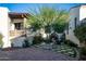 Charming courtyard with a fire pit, seating area, and lush landscaping at 18610 W Porter Dr # 93, Goodyear, AZ 85338