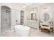 Elegant bathroom featuring a freestanding tub and walk-in shower at 18610 W Porter Dr # 93, Goodyear, AZ 85338