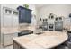 Gourmet kitchen with two-toned cabinetry, large island, and high-end appliances at 18610 W Porter Dr # 93, Goodyear, AZ 85338