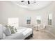 Bright bedroom with large bed and bay windows at 18610 W Porter Dr # 93, Goodyear, AZ 85338