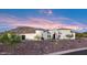 Elegant Spanish-style home with a welcoming entrance and mountain views at 18610 W Porter Dr # 93, Goodyear, AZ 85338