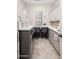Bright laundry room with built-in cabinets and workspace at 18610 W Porter Dr # 93, Goodyear, AZ 85338