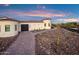 Spanish-style home with a charming brick pathway and desert landscaping at 18610 W Porter Dr # 93, Goodyear, AZ 85338