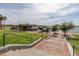 Brick steps lead down to a lakeside park with gazebos and views at 18610 W Porter Dr # 93, Goodyear, AZ 85338