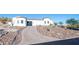 Long paved driveway leading to a beautiful Spanish-style home at 18610 W Porter Dr # 93, Goodyear, AZ 85338