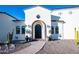 Elegant front entrance with a large dark-stained door and beautiful landscaping at 18610 W Porter Dr # 93, Goodyear, AZ 85338