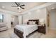 Spacious bedroom with ensuite bathroom access and ceiling fan at 18610 W Porter Dr # 93, Goodyear, AZ 85338