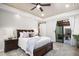 Bright bedroom with private access to a courtyard and a ceiling fan at 18610 W Porter Dr # 93, Goodyear, AZ 85338