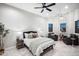 Comfortable bedroom with seating area and large windows at 18610 W Porter Dr # 93, Goodyear, AZ 85338