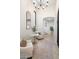 Bright and airy living room with comfortable seating and a large mirror at 18610 W Porter Dr # 93, Goodyear, AZ 85338