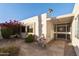 Inviting courtyard entry with flagstone path and fountain at 26218 S Brentwood Dr, Sun Lakes, AZ 85248