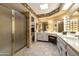 Well-lit bathroom with double sinks and a walk-in shower at 26218 S Brentwood Dr, Sun Lakes, AZ 85248