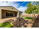 Backyard with fire pit, patio, and grassy area at 29893 N 118Th Dr, Peoria, AZ 85383