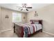 Well-lit bedroom with a ceiling fan and double windows at 7788 W Lone Cactus Dr, Peoria, AZ 85382