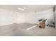 Bright garage with extra space for storage and a side door at 15298 W Linden St, Goodyear, AZ 85338