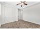 Spacious bedroom featuring a large closet and ceiling fan at 15298 W Linden St, Goodyear, AZ 85338