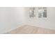 Spacious bedroom with wood flooring and large windows with plantation shutters at 15298 W Linden St, Goodyear, AZ 85338