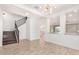 Open dining area with modern staircase and tile floors at 15298 W Linden St, Goodyear, AZ 85338