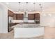 Modern kitchen with granite island and stainless steel appliances at 15298 W Linden St, Goodyear, AZ 85338