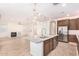 Modern kitchen features granite island, stainless steel appliances, and a spacious layout at 15298 W Linden St, Goodyear, AZ 85338