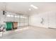 Two-car garage with ample space for storage and a side door at 15298 W Linden St, Goodyear, AZ 85338