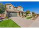 Two-story house with green garage doors and landscaping at 15298 W Linden St, Goodyear, AZ 85338