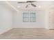 Spacious bedroom featuring wood-look floors and ceiling fan at 15298 W Linden St, Goodyear, AZ 85338
