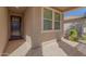 Front entry with dark brown door and tile flooring at 15298 W Linden St, Goodyear, AZ 85338