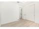 Bright bedroom with double doors and wood-look floors at 15298 W Linden St, Goodyear, AZ 85338