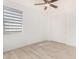 Charming bedroom with wood-look floors and sliding door at 15298 W Linden St, Goodyear, AZ 85338