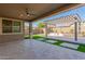 Relaxing backyard oasis with pergola, artificial turf, and patio at 15298 W Linden St, Goodyear, AZ 85338