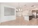Modern kitchen with granite island and stainless steel appliances at 15298 W Linden St, Goodyear, AZ 85338