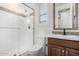 Bathroom boasts a walk-in shower, wood vanity, and modern fixtures at 15298 W Linden St, Goodyear, AZ 85338