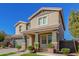 Two-story house with green garage doors and landscaping at 15298 W Linden St, Goodyear, AZ 85338