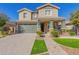 Two-story house with green garage doors and landscaping at 15298 W Linden St, Goodyear, AZ 85338