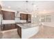 Modern kitchen with large island and stainless steel appliances at 15298 W Linden St, Goodyear, AZ 85338