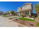Two-story house with green garage doors and landscaping at 15298 W Linden St, Goodyear, AZ 85338
