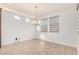 Bright dining room with tile floors and window blinds at 15298 W Linden St, Goodyear, AZ 85338
