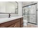 Modern bathroom with a walk-in shower, vanity, and tiled floors at 15298 W Linden St, Goodyear, AZ 85338