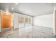 Spacious living area featuring concrete floors and sliding glass doors at 113 E Palm Ln # B, Phoenix, AZ 85004