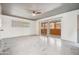 Simple bedroom with concrete floors, ceiling fan and sliding glass doors at 113 E Palm Ln # B, Phoenix, AZ 85004