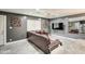 Living room featuring a brown leather sectional and a modern TV at 9023 N 3Rd Ave, Phoenix, AZ 85021